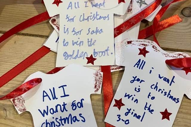 Messages left on the tree asked Santa for an England win ... he wasn't listening