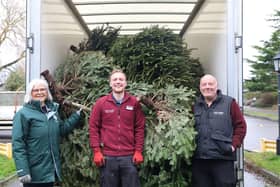 Wendy Agate, from St Peter & St James Hospice, with Cameron Wallis and Richard Knowler from South Downs Nurseries with their first full load of trees.