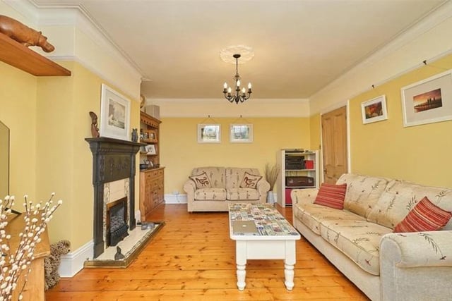 The living room is bright and airy, boasting wooden flooring, gas fire with stunning original cast iron surround, original picture rails and bay window.