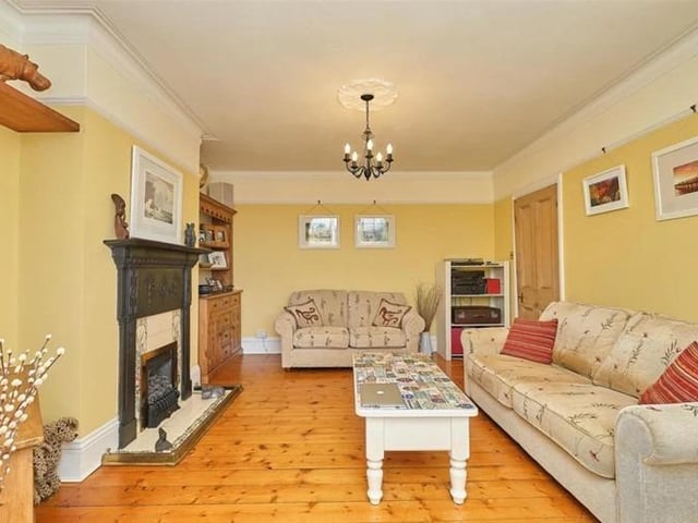 The living room is bright and airy, boasting wooden flooring, gas fire with stunning original cast iron surround, original picture rails and bay window.