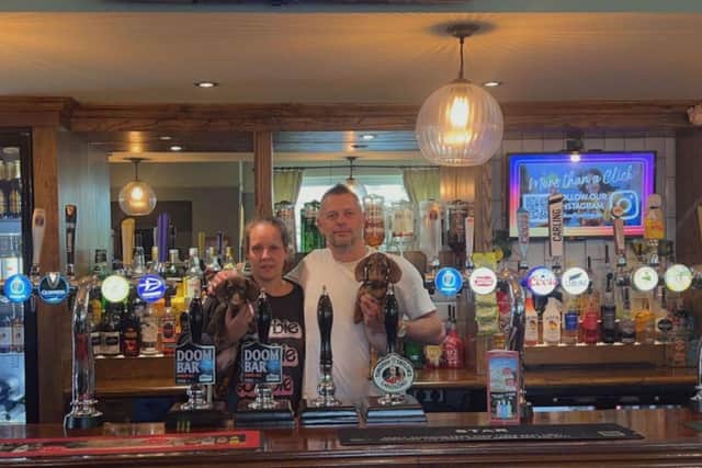 Sarah and Aaron Bruce - new landlords of The Star pub in Crawley Road, Roffey - with Dachsund pups Ronnie and Reggie. Photo contributed