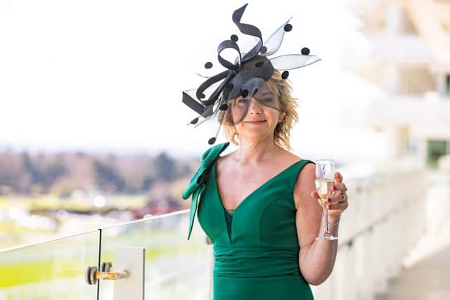 Linda Goode modelling a John Boyd hat named Royal Wave.