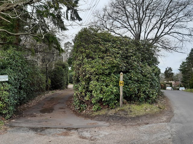 Look out for this little yellow footpath sign and follow this path past Firtree Cottage and Ridge Top