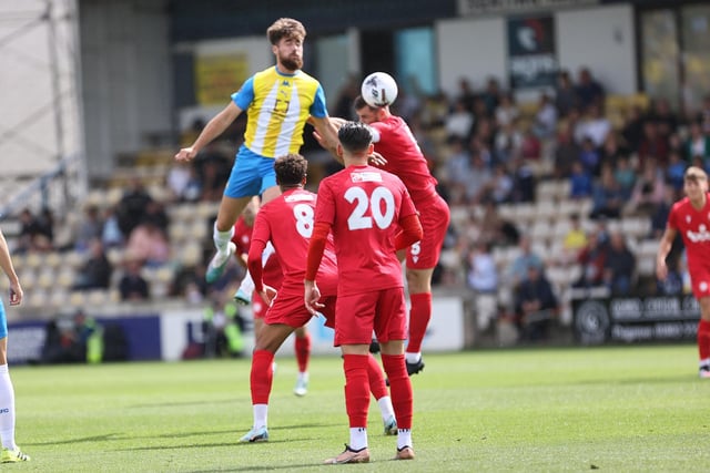 Action from Worthing's 3-0 win at Torquay United which put them top of National League South