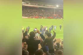 Brighton fans celebrating with the team after a much needed win.