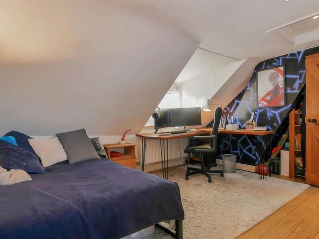 The principal bedroom on the top floor has an en-suite shower room