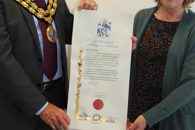 Horsham District Council chairman with calligrapher Cathy Stables
