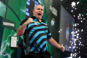 Rob Cross celebrates winning his world quarter final against Chris Dobey last week - now he has been confirmed for the 2024 Premier League (Photo by Tom Dulat/Getty Images)