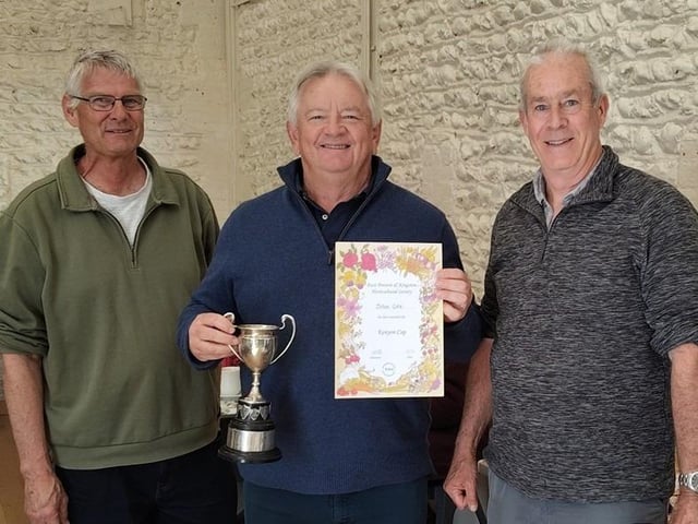 John Cole, centre, receiving the Kenyon Cup from Chris Hill and Simon Smith