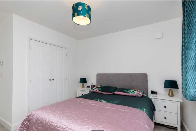 There are three bedrooms, two of which are doubles both with fitted wardrobes, while the main bedroom has a well-equipped en-suite shower room with a walk-in shower, wash hand basin and a low-level WC.