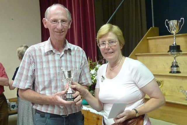 Michael Kingsford being presented with the Secretary’s Challenge Cup by Lavant Horticultural Society show secretary Pauline Williams in September 2011