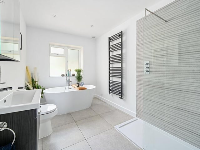 The family bathroom features a walk-in shower