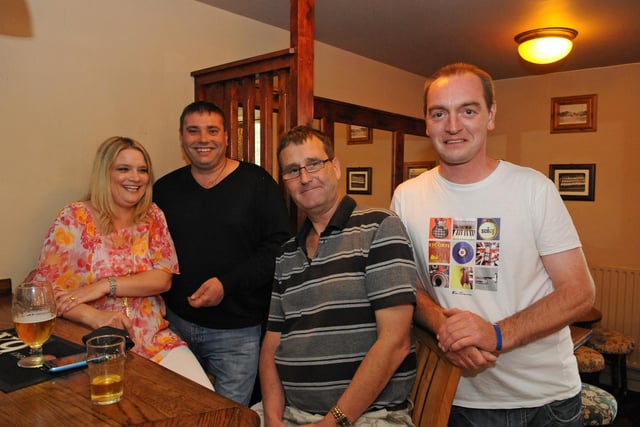 Inside The Salisbury Arms in  Lonsdale Avenue Cosham in 2011. Pictured: (left to right) Pub regulars Carianne Davison (28) with Brian Davison (42), Steve Pinestone (51) and Chris Stoner (38). Picture: Malcolm Wells (112400-3630)