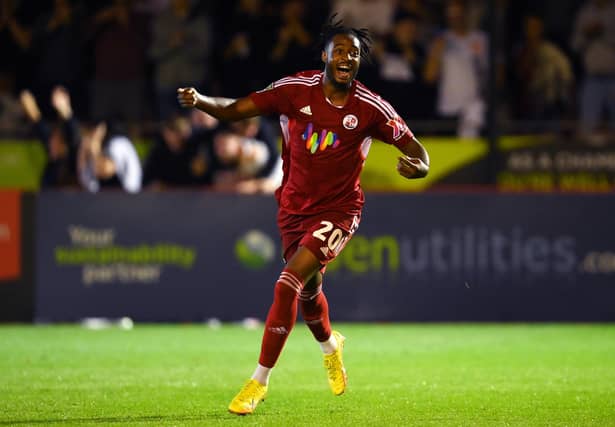 CRAWLEY, ENGLAND - AUGUST 23: James Balagizi of Crawley Town celebrates after scoring their team's second goal during the Carabao Cup Second Round match between Crawley Town and Fulham at Broadfield Stadium on August 23, 2022 in Crawley, England. (Photo by Mike Hewitt/Getty Images)