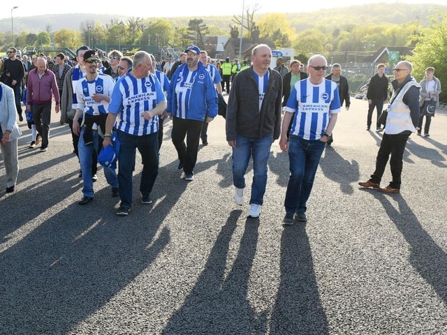 Fans arrive at the stadium for the Premier League match between Brighton and Hove Albion and Manchester United at Amex Stadium on May 4, 2018.