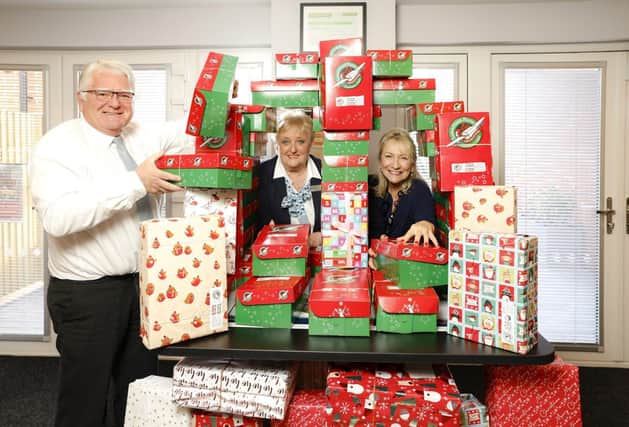 David Wilson Homes Sales team with the shoeboxes