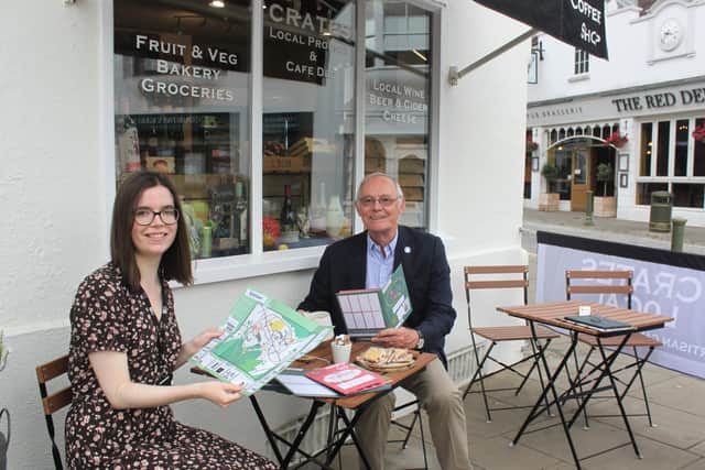 Horsham District Council Leader and Cabinet member for Local Economy Cllr Jonathan Chowen and Economic Development Officer Ellen Kendrick pick up their Mystery Trail packs from participating Crates Local in Horsham