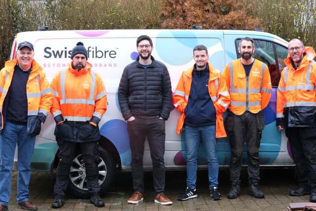 Tim Morris (centre) with the Swish Fibre team on install day