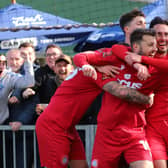Ollie Pearce is mobbed after scoring the late goal that proved the winner against Maidstone | Picture: Mike Gunn