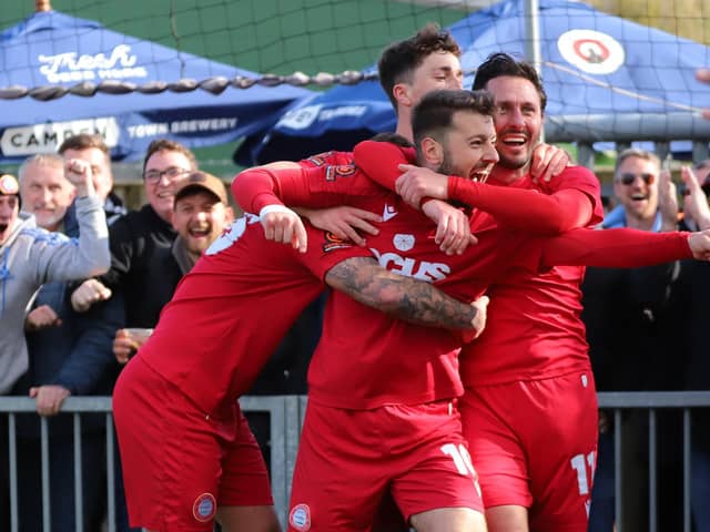 Ollie Pearce is mobbed after scoring the late goal that proved the winner against Maidstone | Picture: Mike Gunn