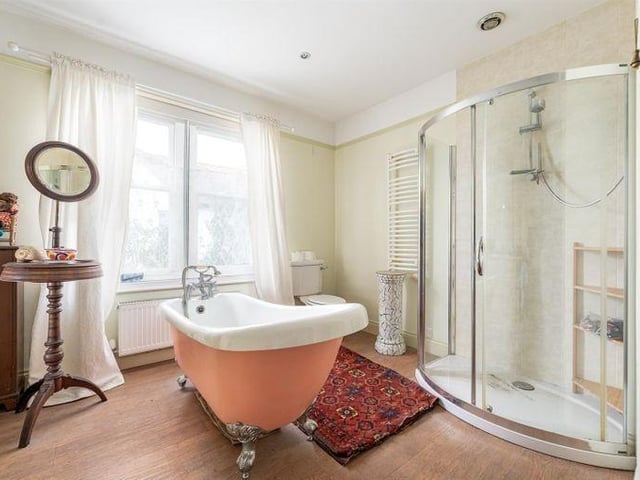 This is the largest of three bathrooms
