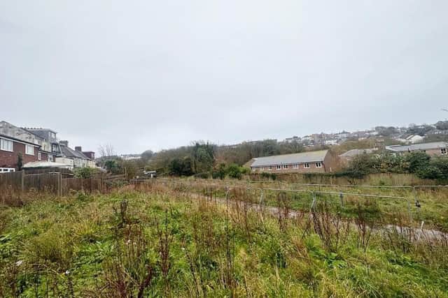 Land with planning consent for five houses on the outskirts of Hastings has sold through auction.