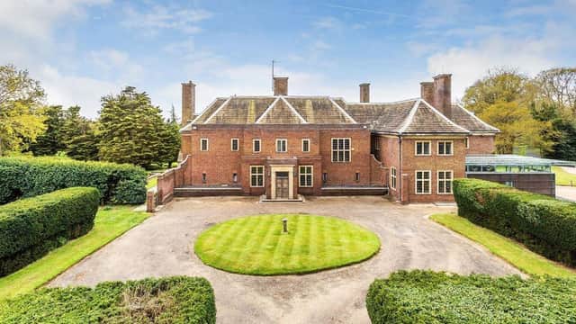 This stunning eight-bedroom property is set in 28 acres of gardens and parkland at Itchingfield, near Horsham