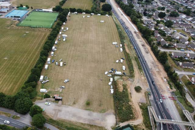 An aerial drone picture, taken this evening (Tuesday, July 12), shows multiple vehicles parked on the football pitch outside The Angmering School in Station Road. Photo: Eddie Mitchell