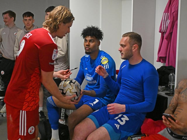 The Crawley Town players sign the hat trick match ball for Crawley Town forward Danilo Orsi (9) during the EFL Sky Bet League 2 play-off second leg match between Milton Keynes Dons and Crawley Town at stadium:mk, Milton Keynes, England on 11 May 2024.:Crawley Town hammered MK Dons 5-1 - and 8-1 on aggregate - to reach the League Two play-off final Wembley. Photographer Dennis Goodwin/Pro Sport Images was there to catch the action, the crowd and the celebrations
