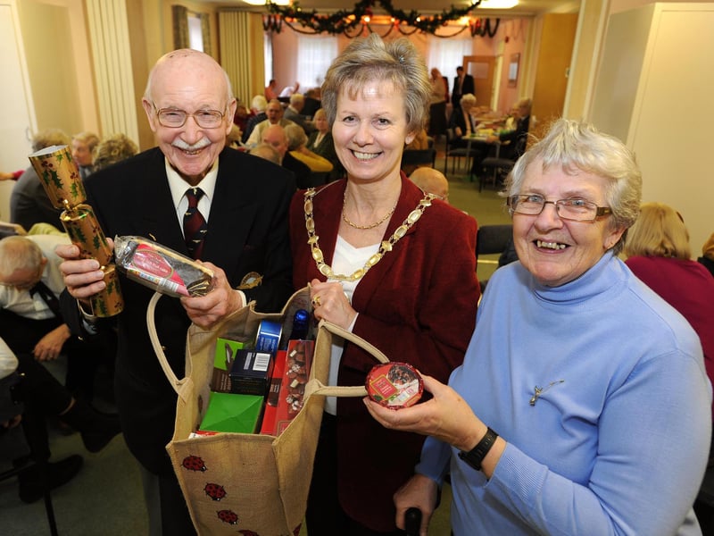 Former Lancaster pilot Reg Barker receives a Christmas food hamper from mayor Margaret Baker and Shirley Gawan (Secretary RAFA) at their Christmas buffet