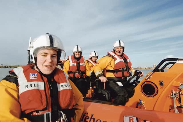 Olly Clarke at 17, left, with Littlehampton RNLI crew. Credit: RNLI