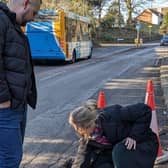 Sally-Ann inspecting a local pothole 