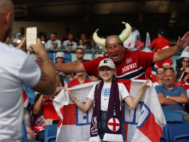 The fans mix ahead of kick-off.
