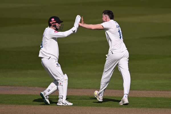 Jack Carson celebrates with skipper John Simpson after dismissing Miles Hammond of Gloucestershire during the visitors' first innings in the Vitality County Championship match at The 1st Central County Ground (Photo by Mike Hewitt/Getty Images)