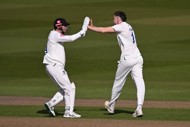 Jack Carson celebrates with skipper John Simpson after dismissing Miles Hammond of Gloucestershire during the visitors' first innings in the Vitality County Championship match at The 1st Central County Ground (Photo by Mike Hewitt/Getty Images)