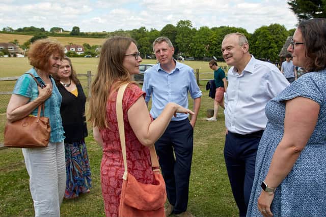 James MacCleary and Ed Davey  listening to members of Friends of Alfriston Playground