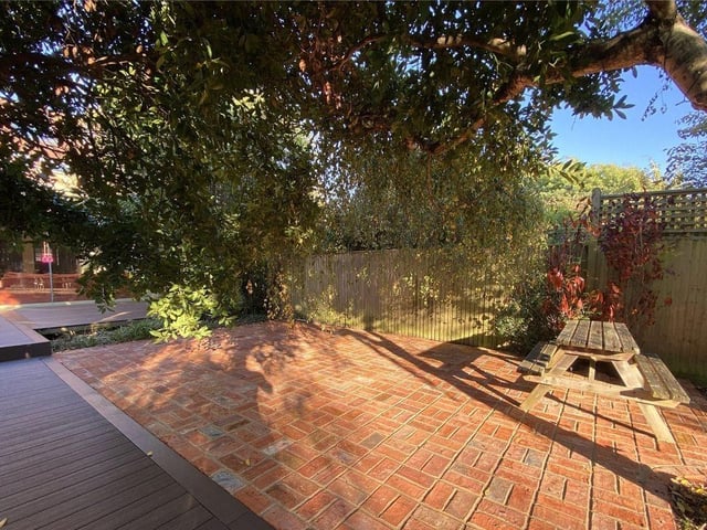 One area of the garden is paved with reclaimed bricks