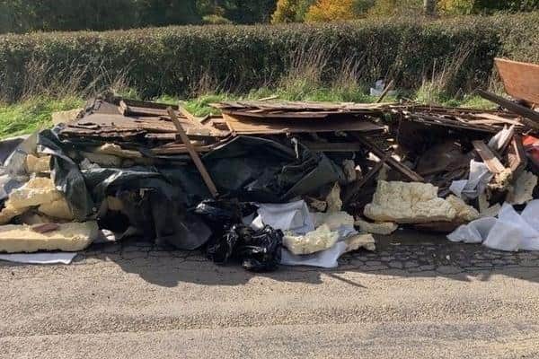 Almost a tonne of waste was dumped on the road near a major junction south of Horsham