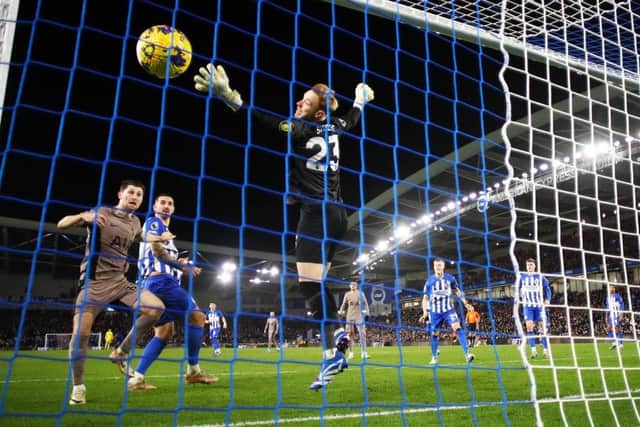 BRIGHTON, ENGLAND - DECEMBER 28: (EDITORS NOTE: In this photo taken from a remote camera from behind the goal.) A general view as Ben Davies of Tottenham Hotspur scores their team's second goal whilst under pressure from Lewis Dunk of Brighton & Hove Albion as Jason Steele of Brighton & Hove Albion fails to make a save during the Premier League match between Brighton & Hove Albion and Tottenham Hotspur at American Express Community Stadium on December 28, 2023 in Brighton, England. (Photo by Bryn Lennon/Getty Images)