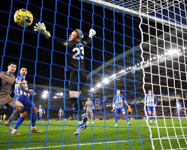 BRIGHTON, ENGLAND - DECEMBER 28: (EDITORS NOTE: In this photo taken from a remote camera from behind the goal.) A general view as Ben Davies of Tottenham Hotspur scores their team's second goal whilst under pressure from Lewis Dunk of Brighton & Hove Albion as Jason Steele of Brighton & Hove Albion fails to make a save during the Premier League match between Brighton & Hove Albion and Tottenham Hotspur at American Express Community Stadium on December 28, 2023 in Brighton, England. (Photo by Bryn Lennon/Getty Images)