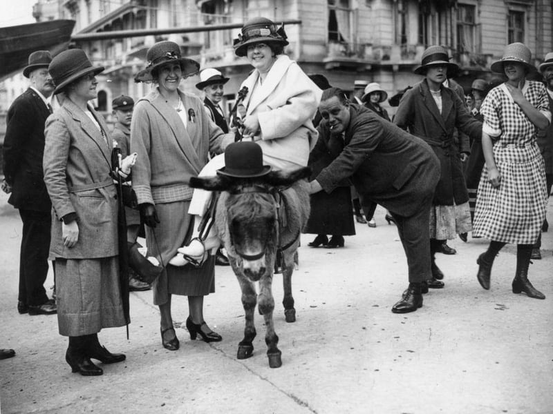 Workers from Tickler's Jam factory enjoy a donkey ride on an outing to Hastings in September 1923.