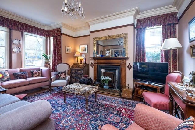 The drawing room has an Edwardian wooden surround fireplace