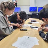 Collyer's engineering students disassemble the 'phones 