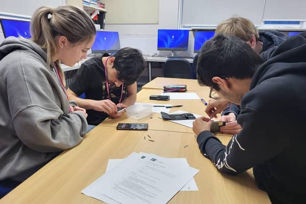 Collyer's engineering students disassemble the 'phones 