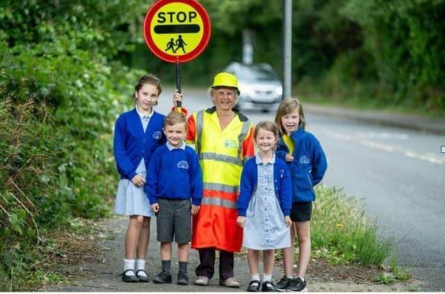 Lollipop lady Mary Nye is celebrating spending 50 years helping Horsham schoolchildren to safely cross the town's roads. Photo contributed