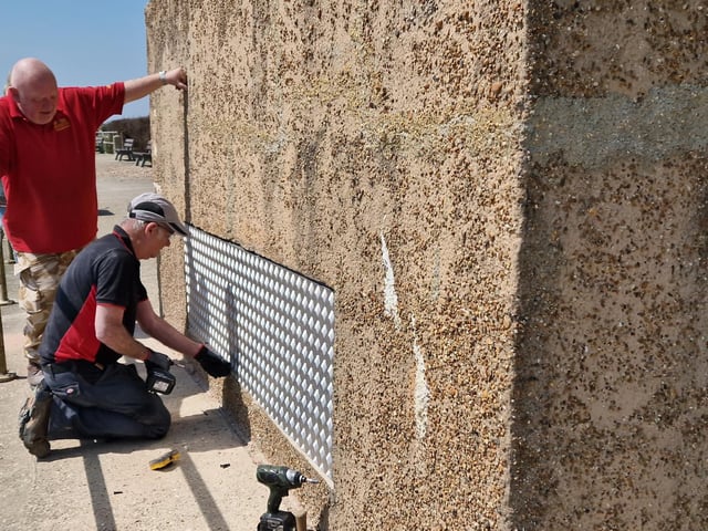 Pete Coe, one of the project leaders, and fellow former Royal Engineer Graham Cosham worked together to open the southern embrasure at the Ferring pillbox