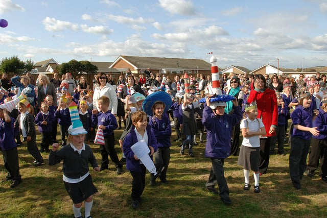 Staff and pupils gathered on the school field to watch the balloons