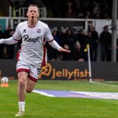 Harry McKirdy celebrates one of his two goals in the vital win at Newport County last season | Picture: Kyle Hemsley