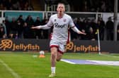Harry McKirdy celebrates one of his two goals in the vital win at Newport County last season | Picture: Kyle Hemsley