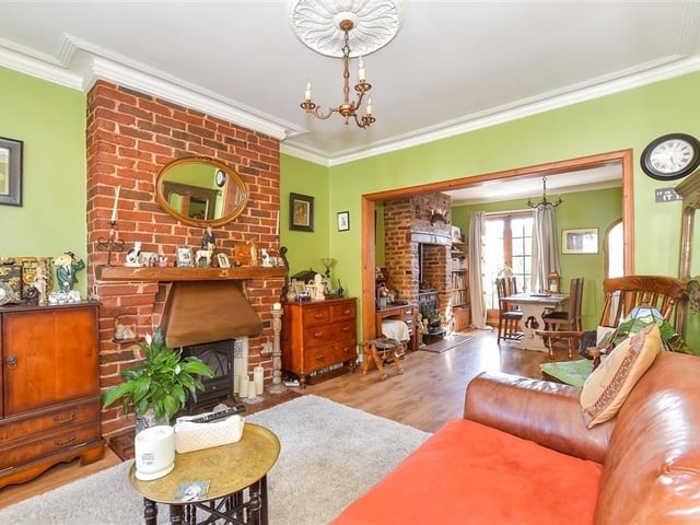 The dining area features an attractive wood burner